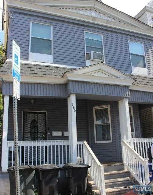 front view of a house with a deck