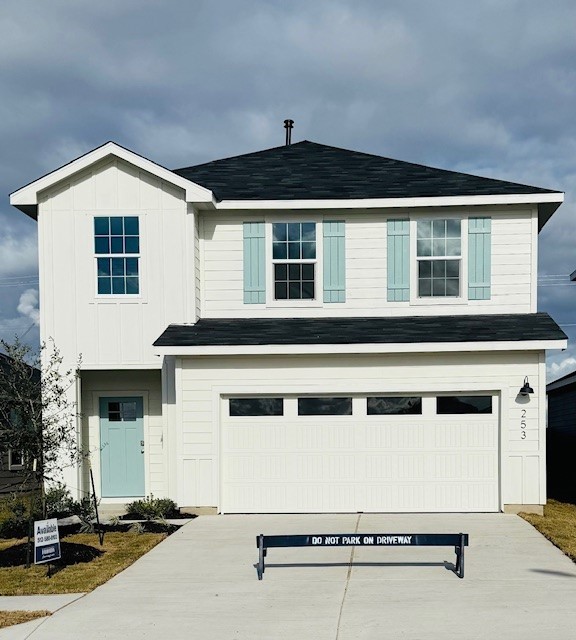 a front view of a house with a garage