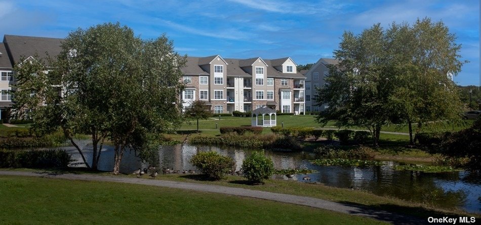 a view of a lake with a building in the background