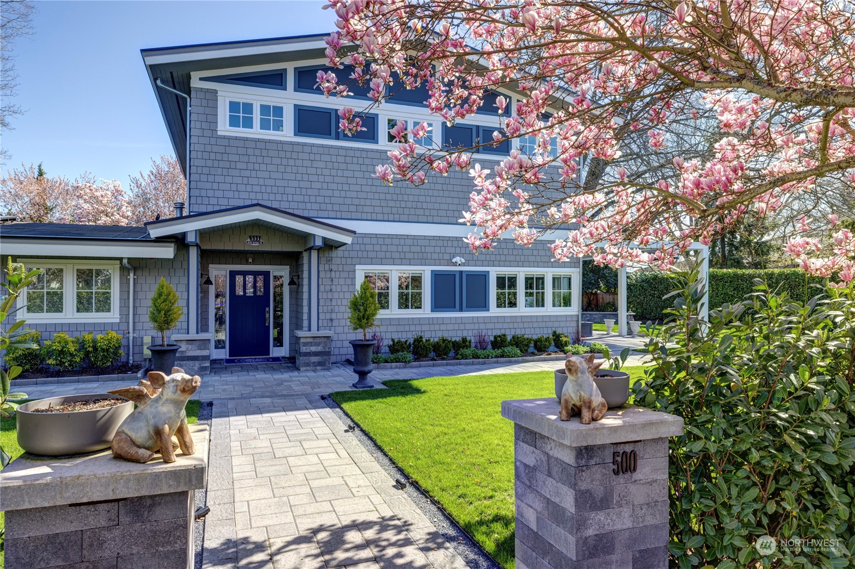 a view of house with a yard and furniture