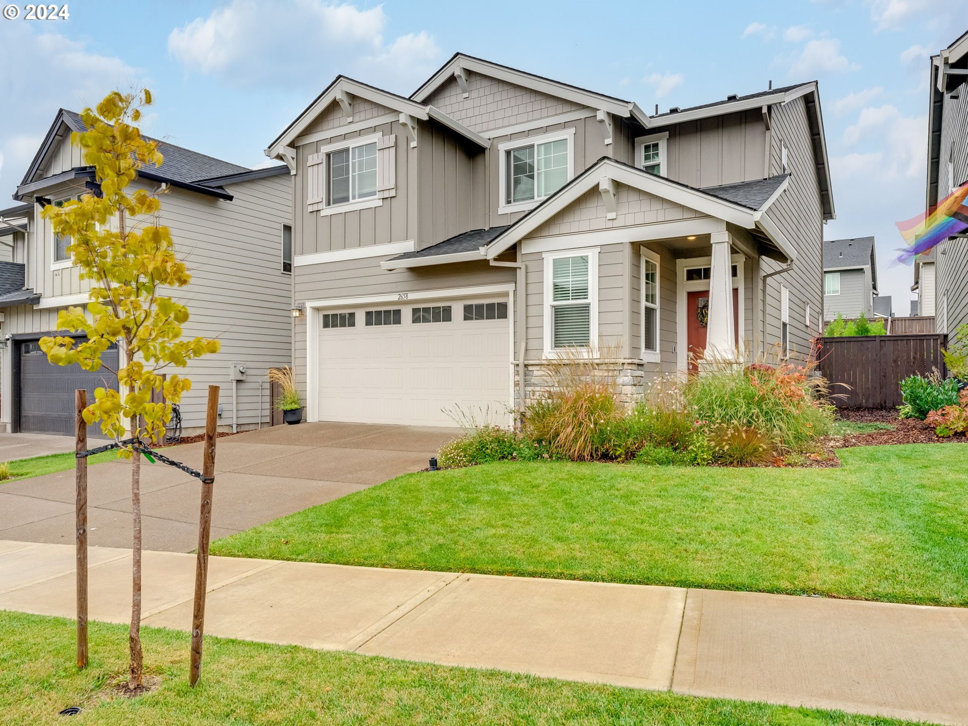 a front view of a house with a yard