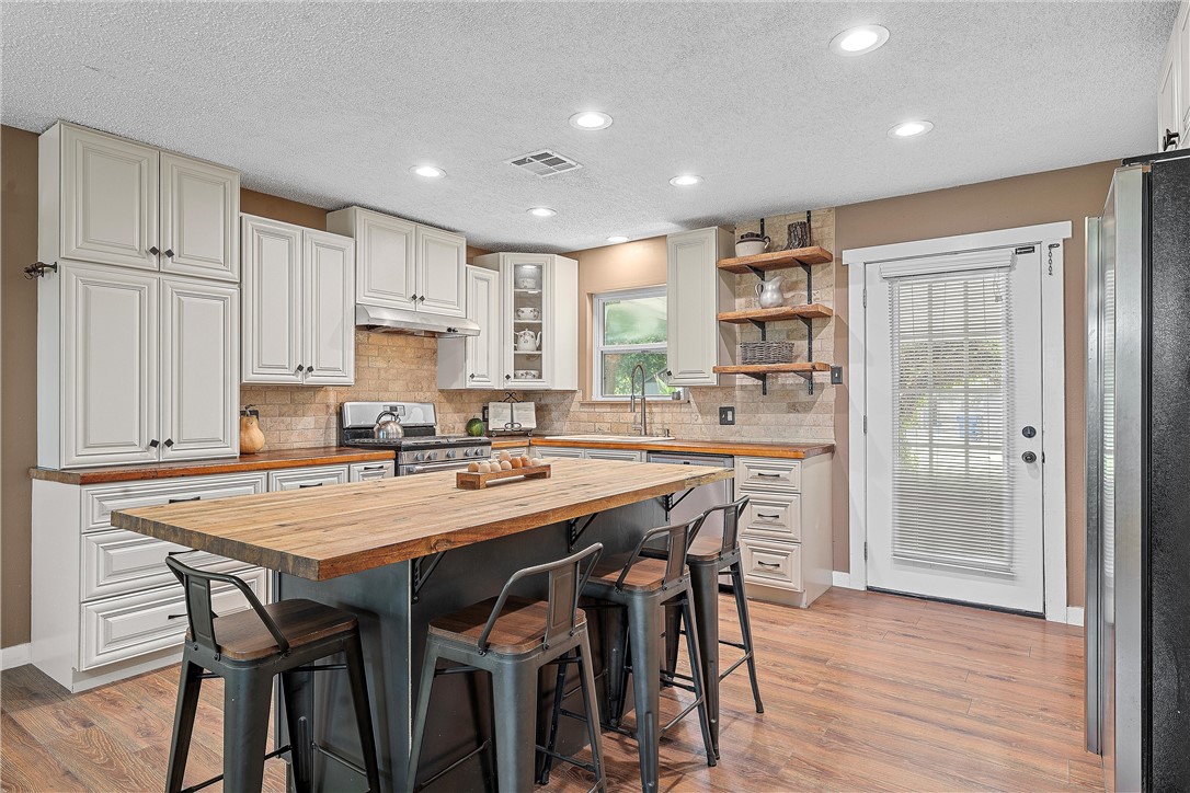 a kitchen with a table and chairs in it