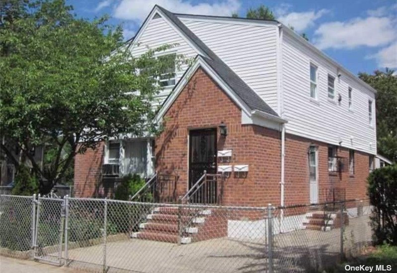 a front view of a house with garage