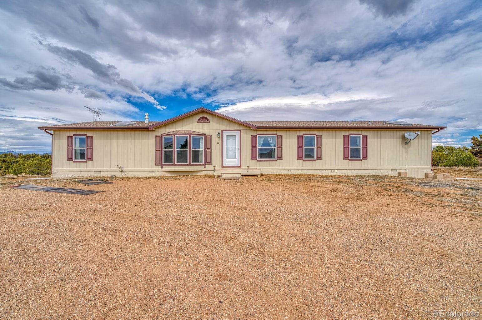 front view of house with deck and outdoor space