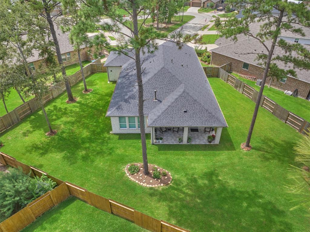 Wow! Welcome to Bonterra at Woodforest, 55+ community.  This large back yard is ideal for gardening and is a great space for dogs and grandkids to run and play!  Front yard maintenance is covered by the HOA and the back yard can be added for a minimal fee.