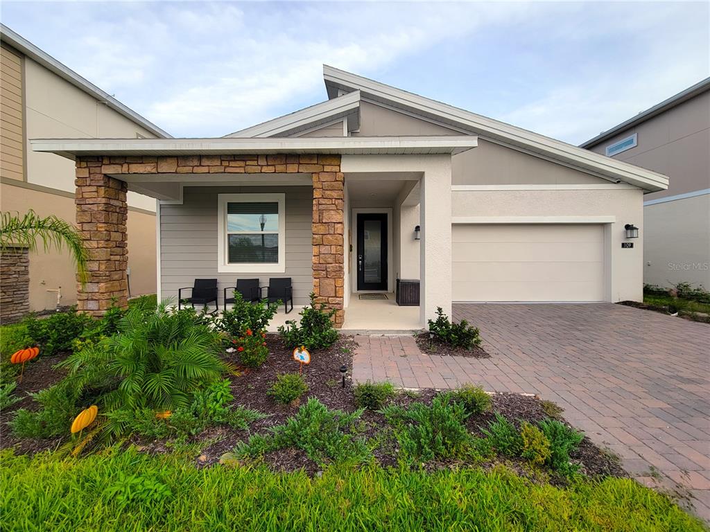 a front view of a house with garden