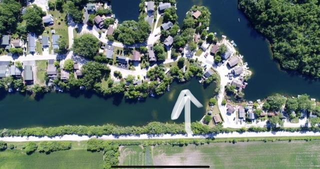 a view of a lake with a house in the background