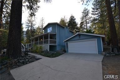 a view of backyard and house