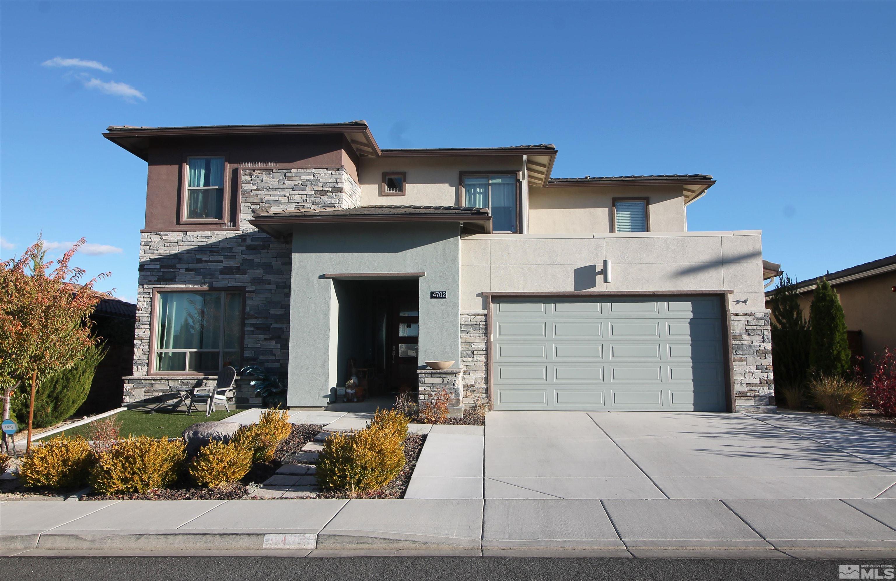 a front view of a house with entertaining space