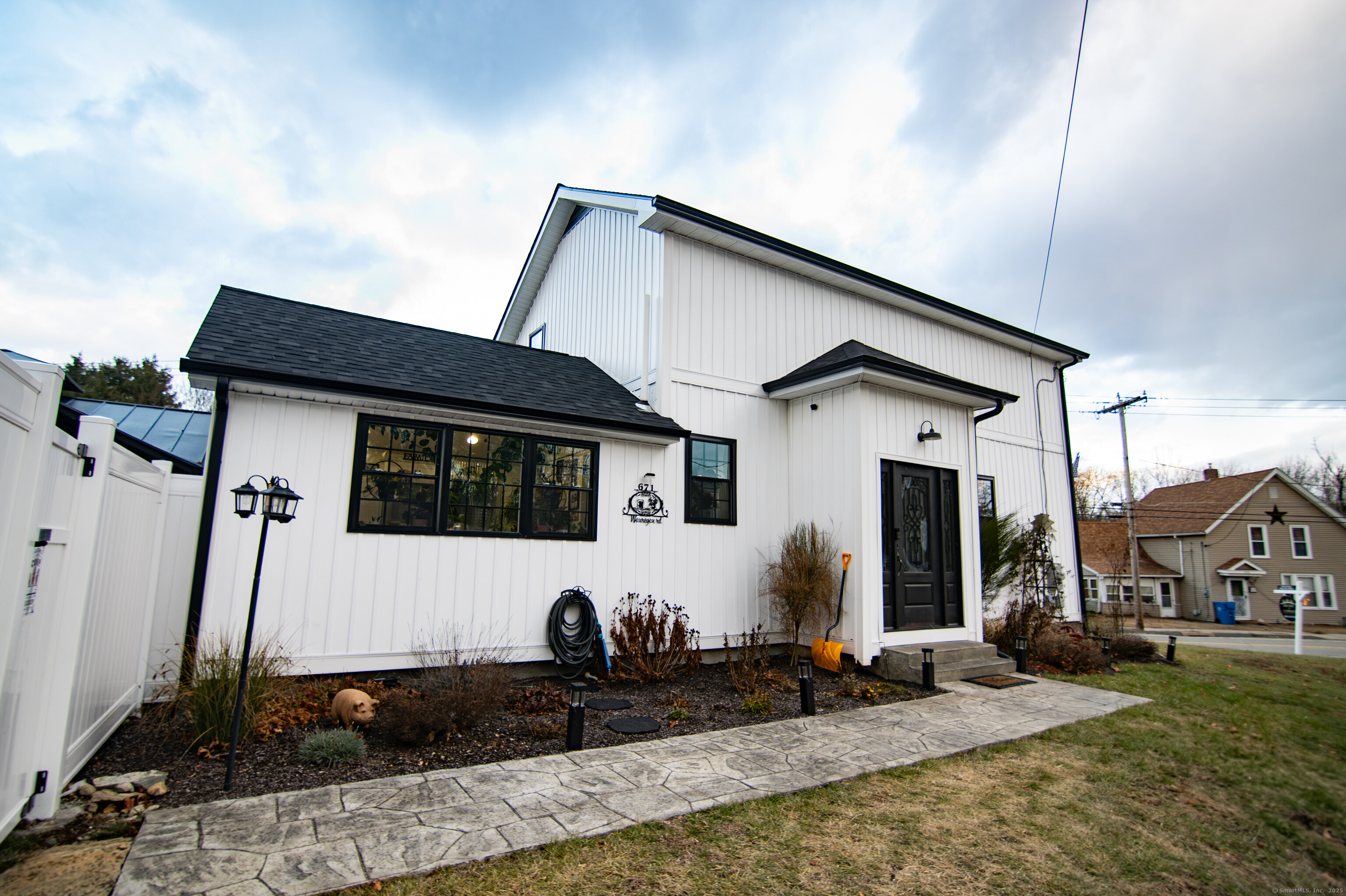 a front view of a house with garden