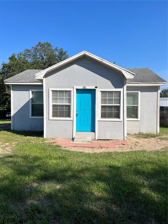 front view of a house with a yard