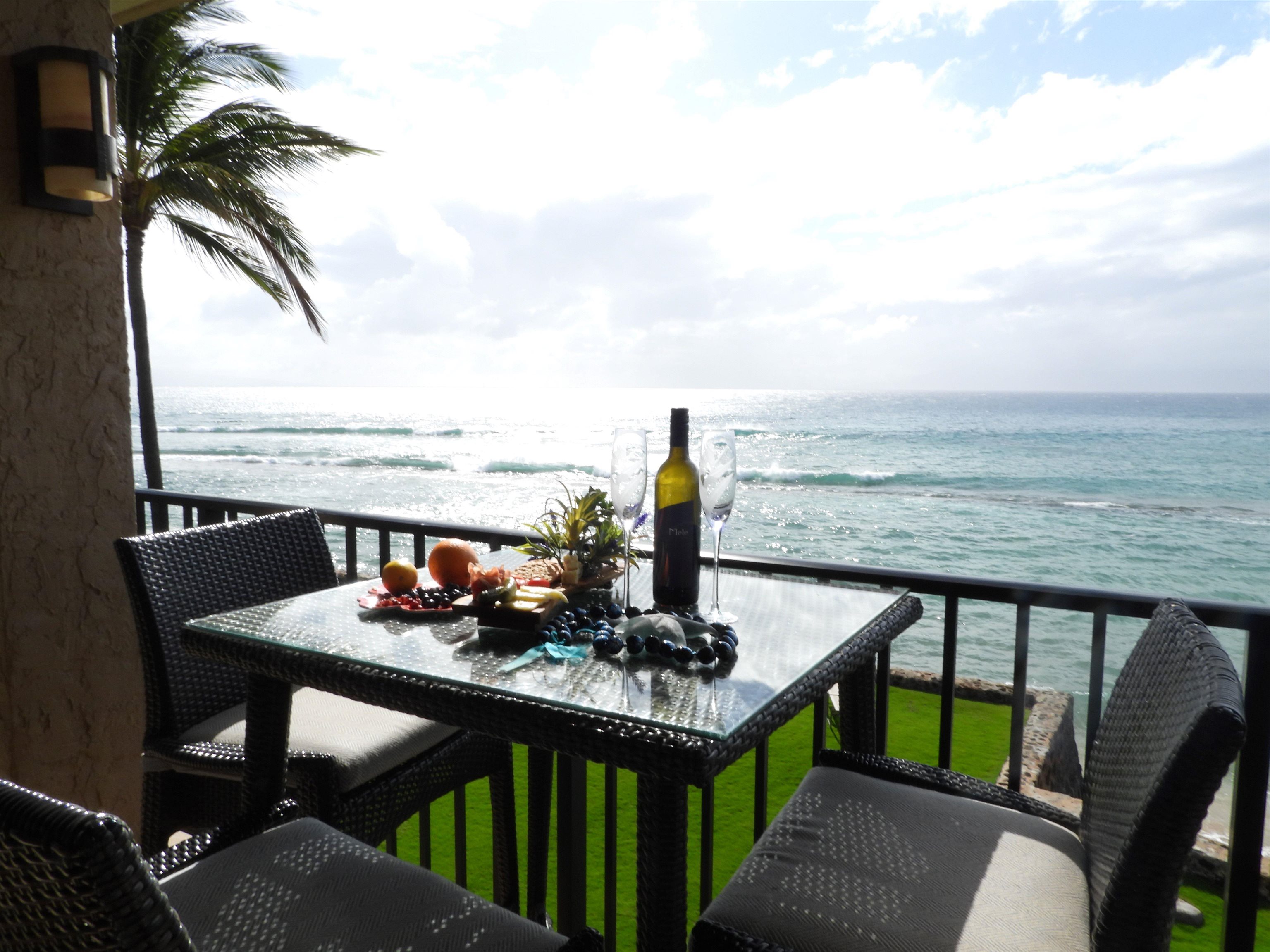 a view of a balcony with mountain view and ocean view