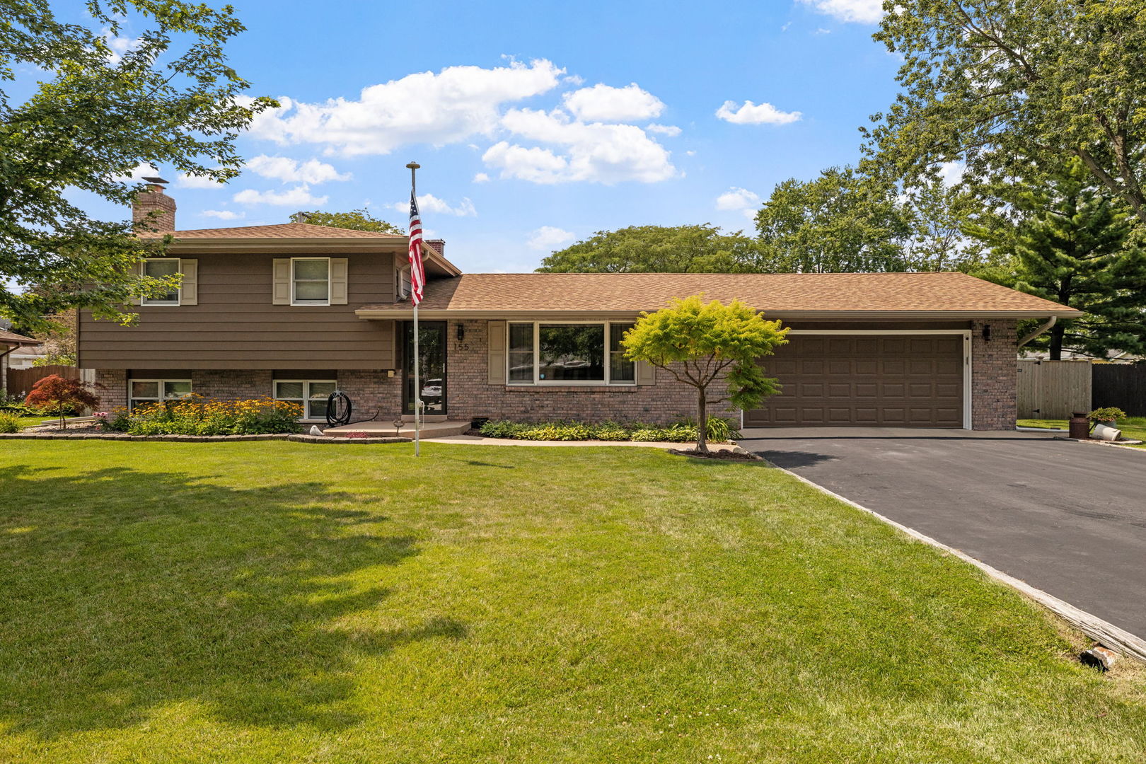 a front view of a house with yard