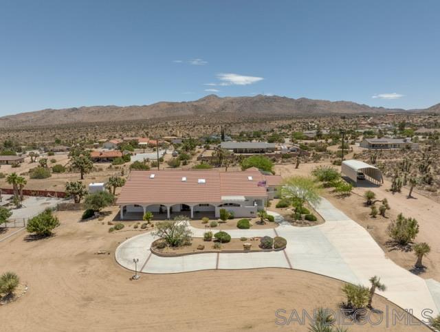 an aerial view of residential houses and outdoor space