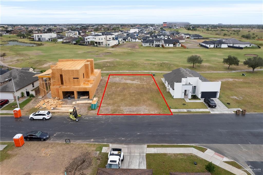 an aerial view of a house with a ocean view