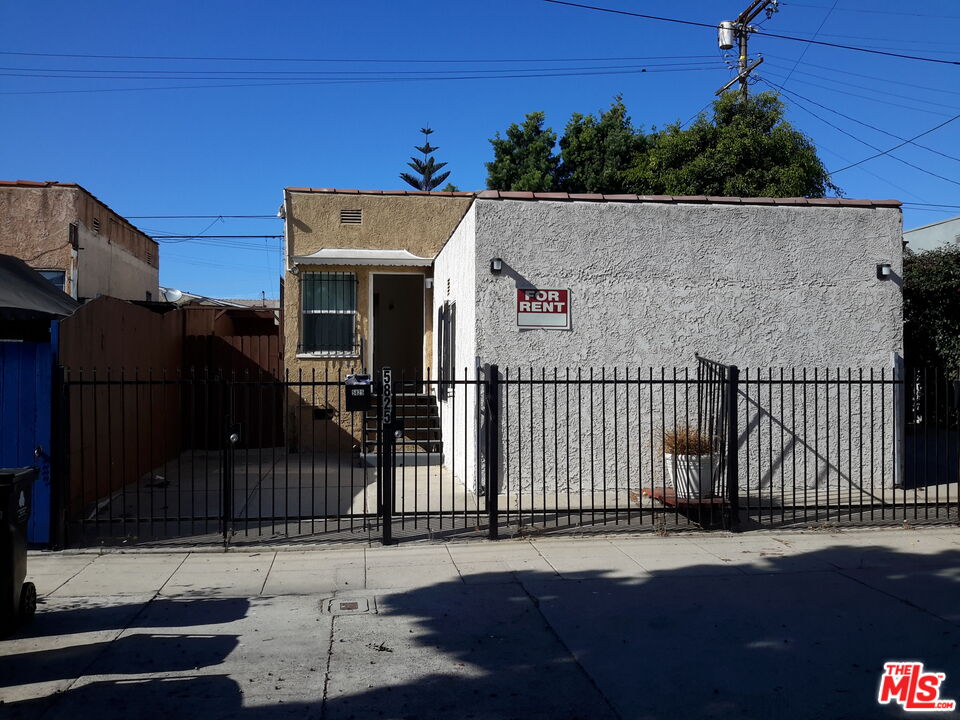 a view of a house with a street