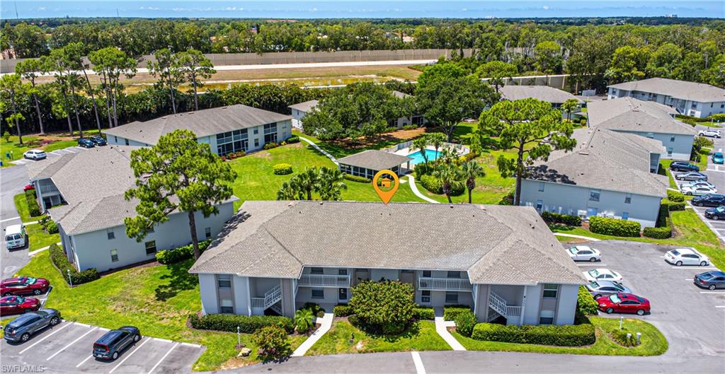 an aerial view of house with yard swimming pool and outdoor seating