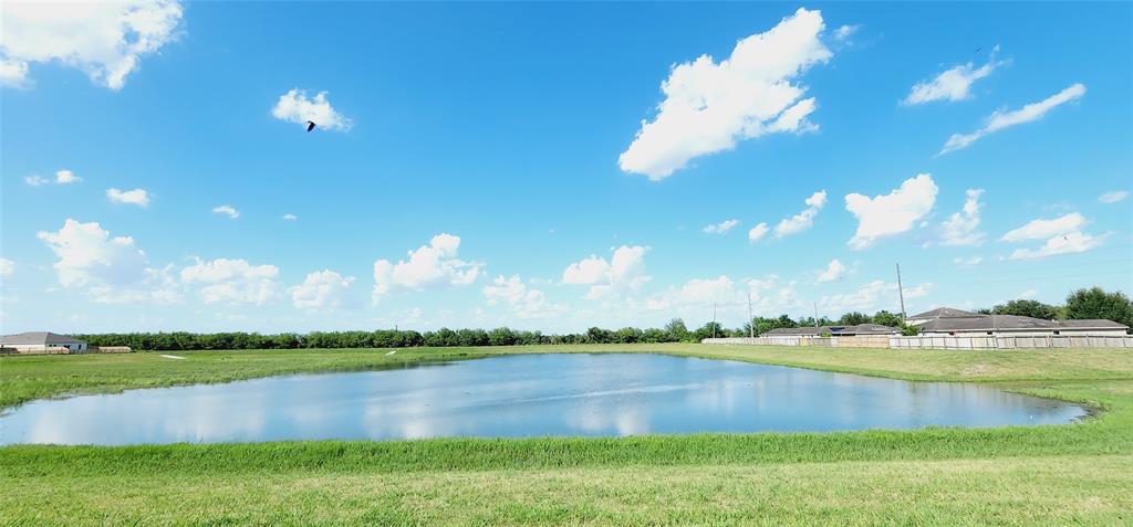 a view of a lake and a yard