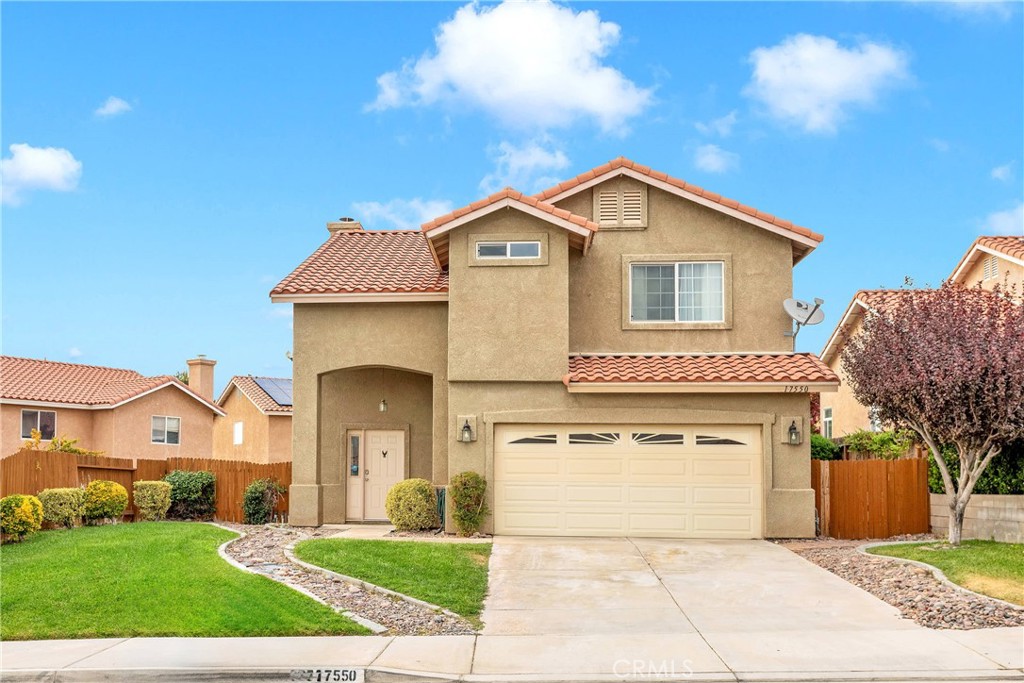 a front view of a house with yard