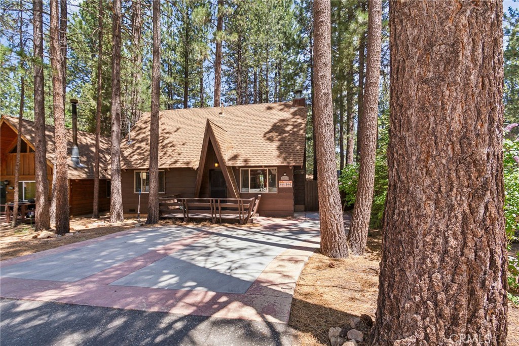 a view of outdoor space with deck and trees