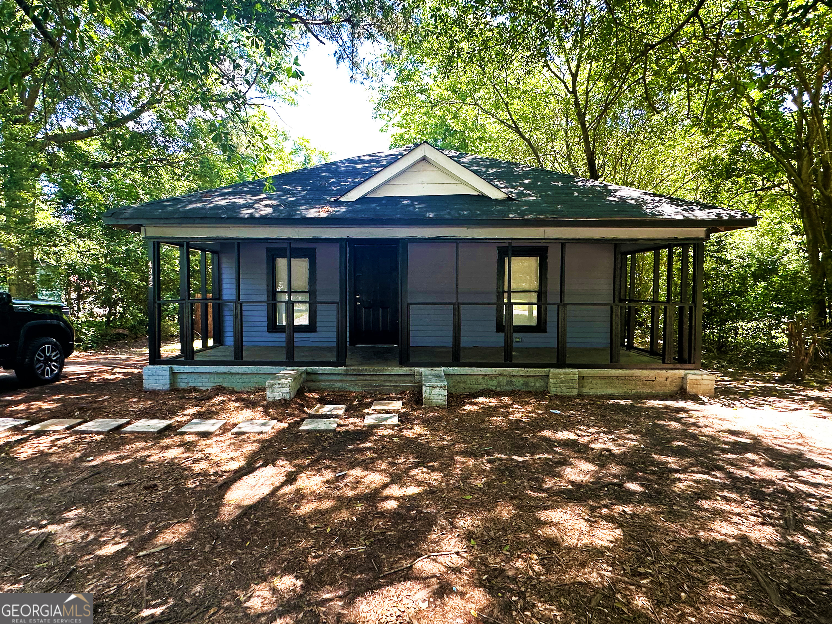 a front view of a house with yard