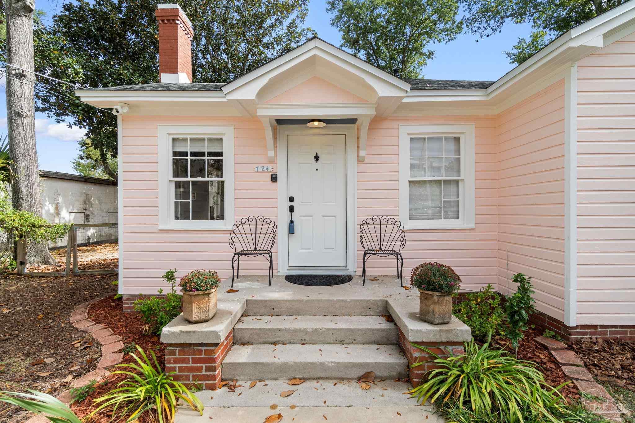 a view of a house with sitting area and furniture