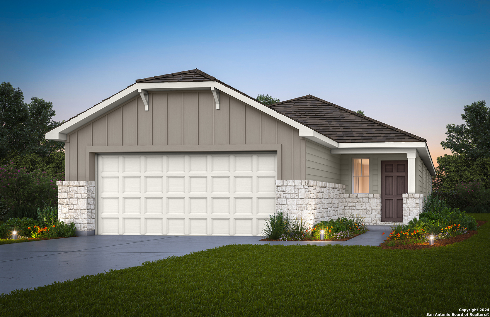 a front view of a house with a yard and garage