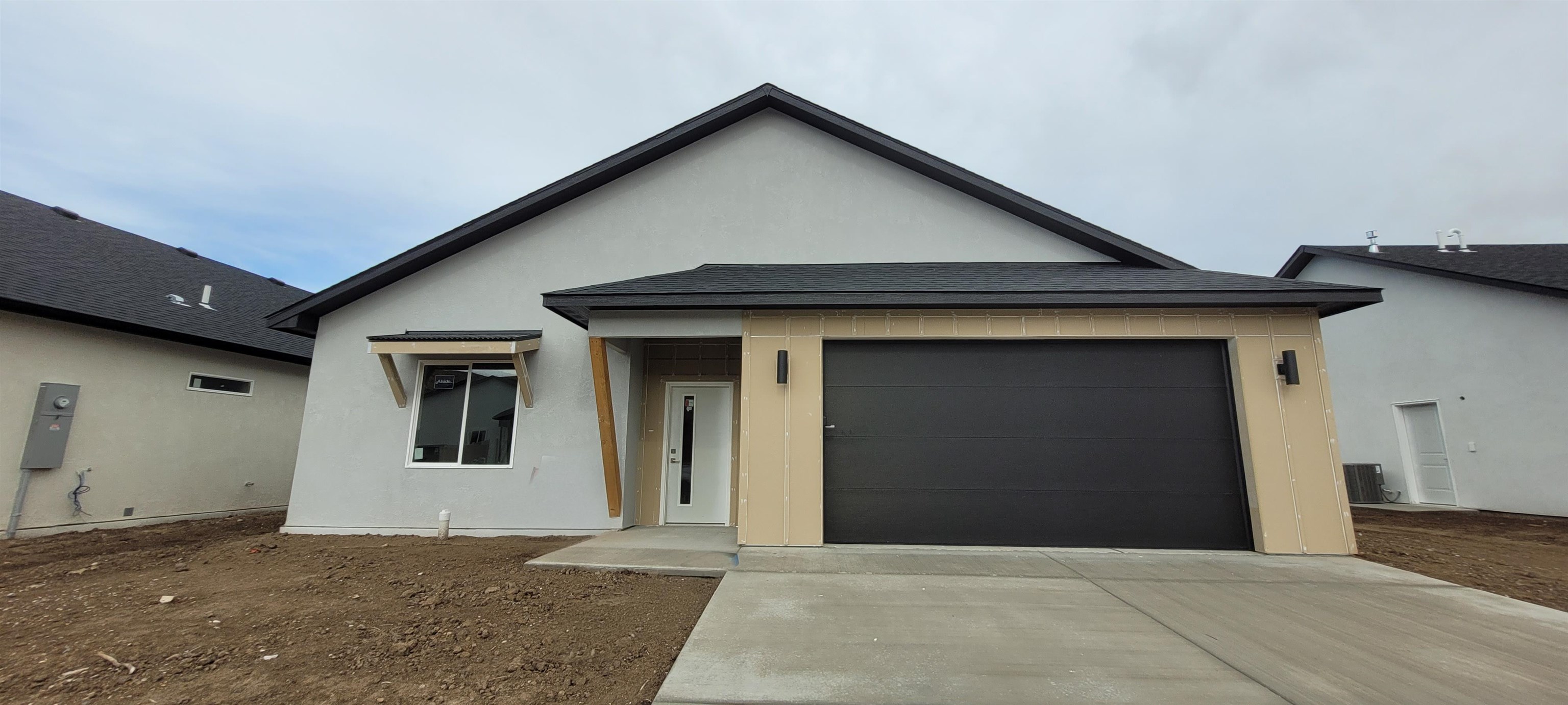 a front view of a house with garage