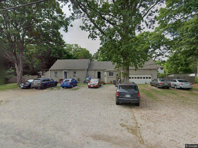 a car parked in front of a house