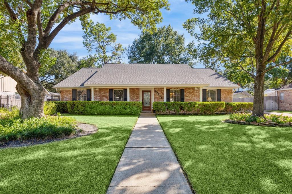 a front view of a house with yard