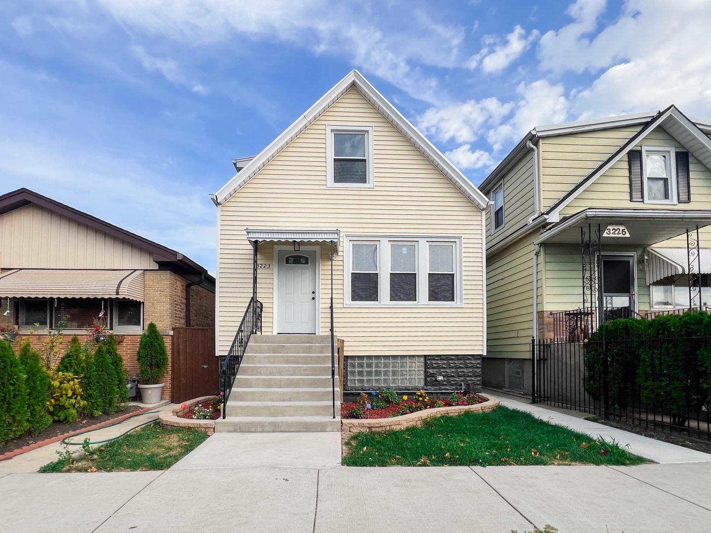 a front view of a house with a yard