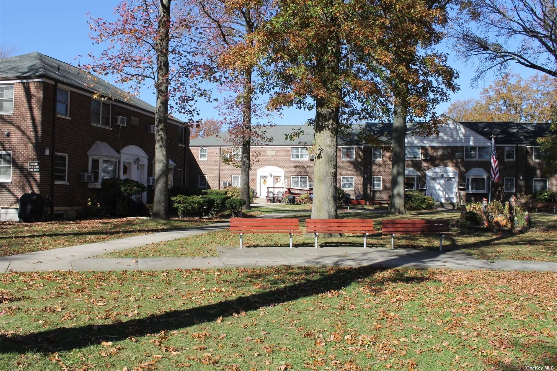 a view of street along with house and trees