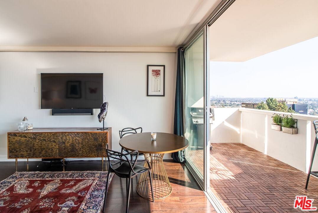 a living room with a couch and a rug