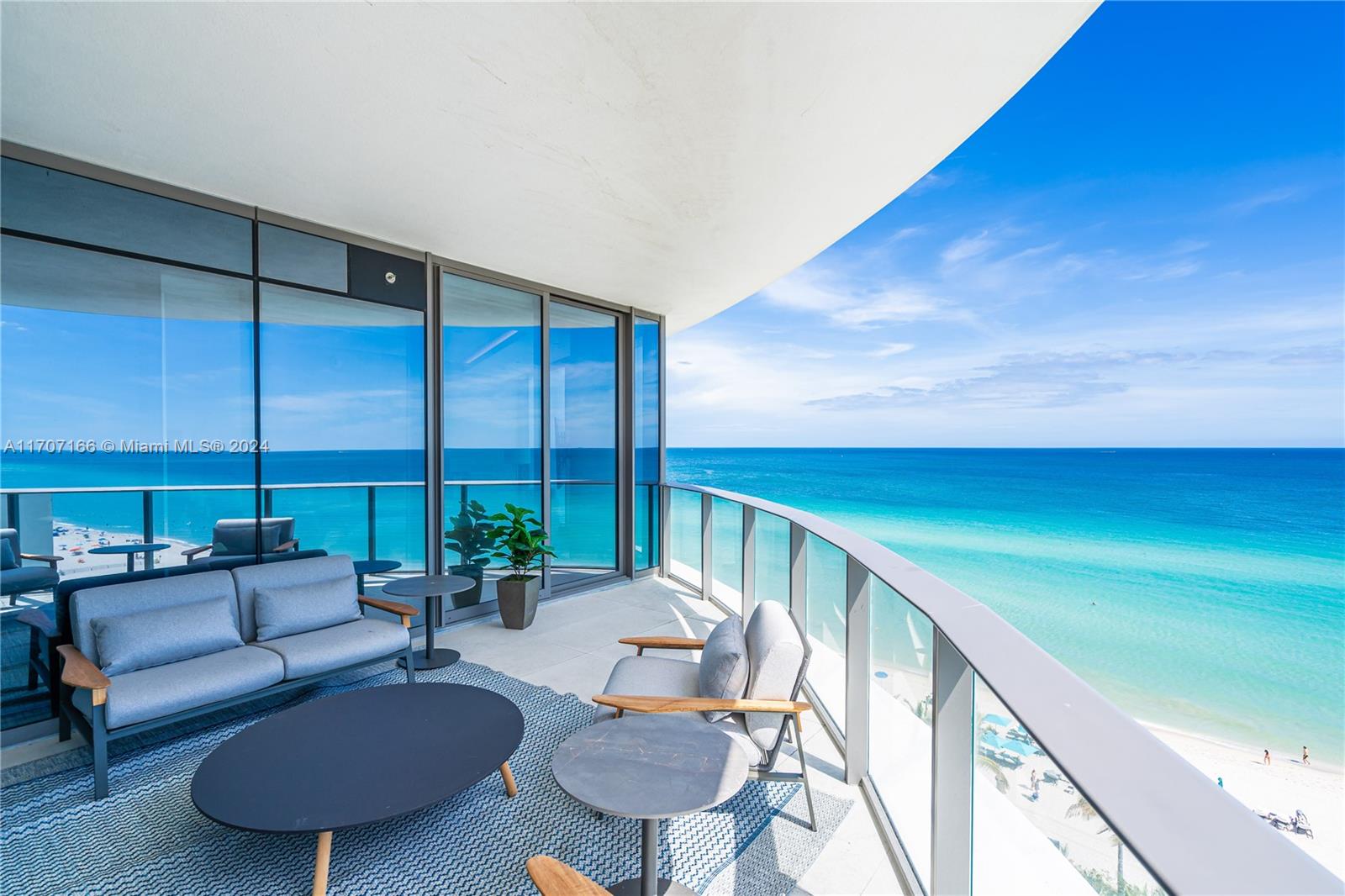 a balcony with furniture and wooden floor