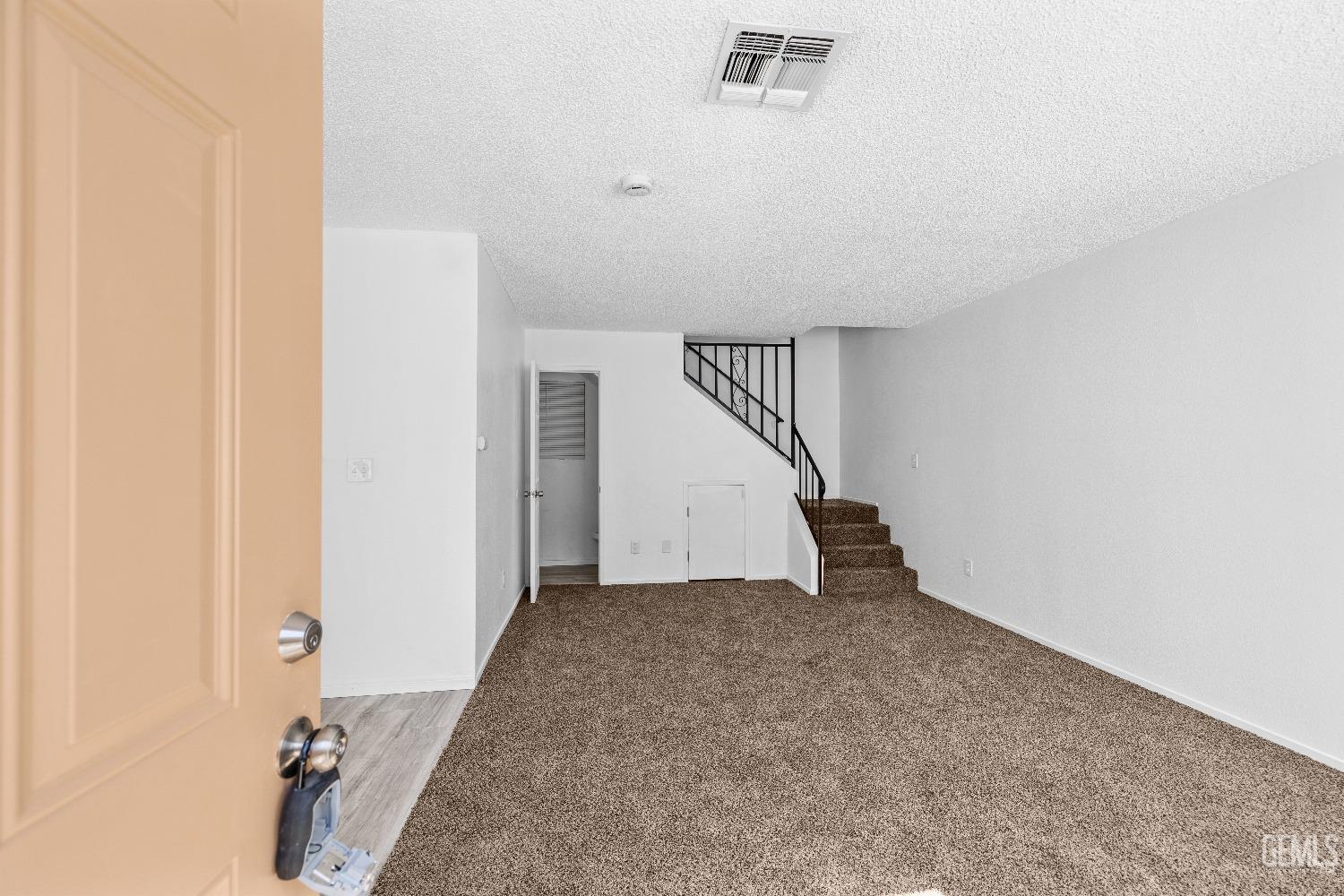 a view of a hallway with staircase