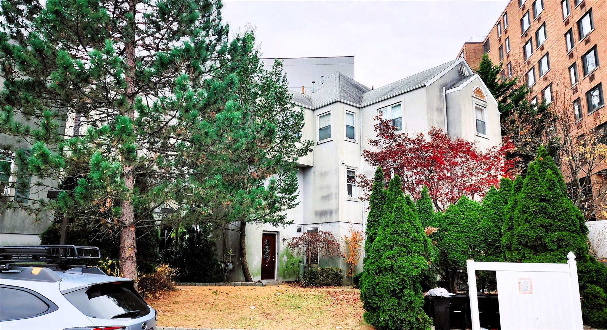 a front view of a house with yard