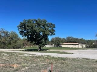 a view of lake with a yard