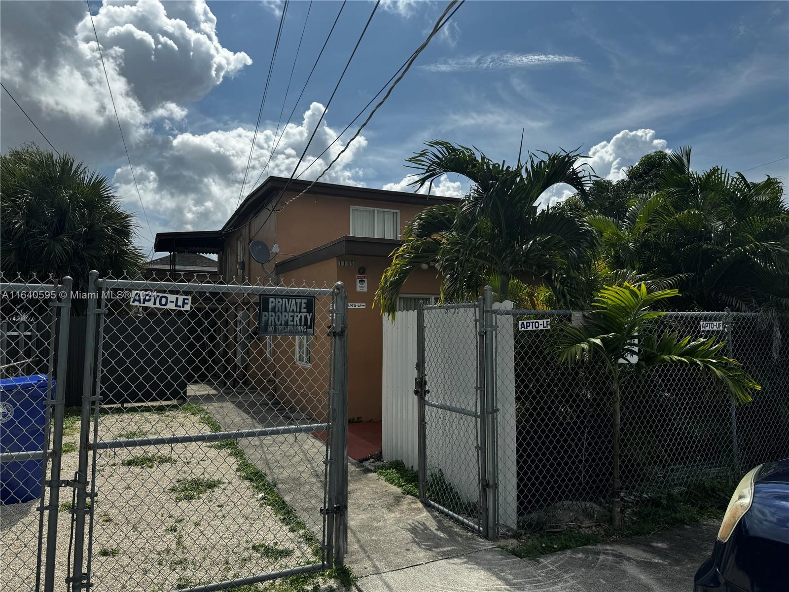 a view of a house with a flower garden