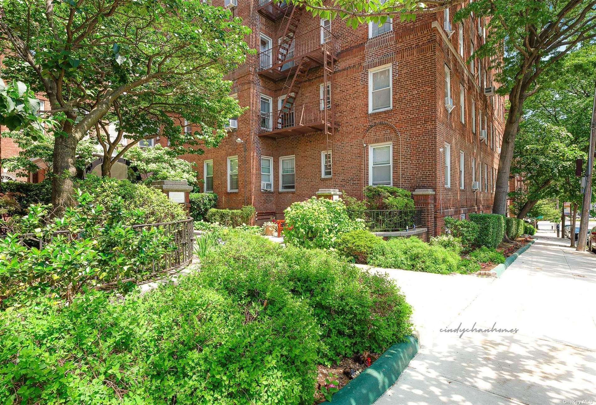 a view of a building with a garden