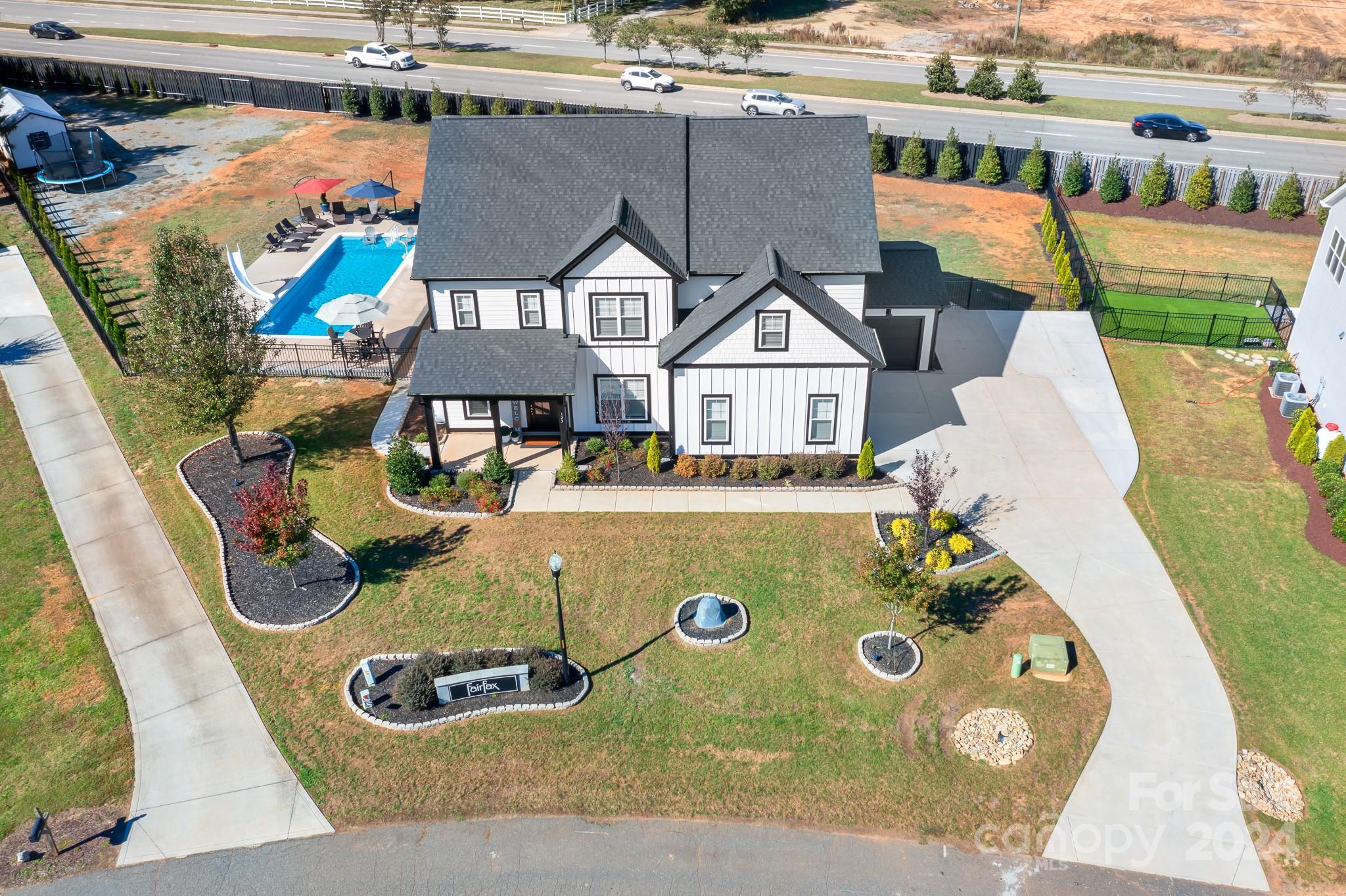 an aerial view of a house with swimming pool