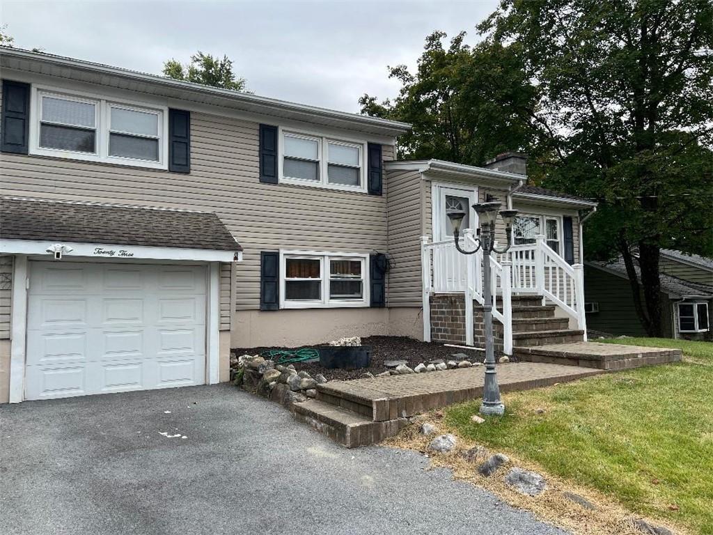 View of front of property featuring a garage