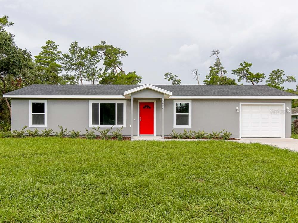 front view of a house with a yard