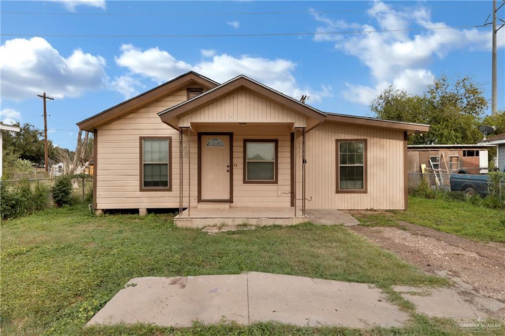 View of front of house with a front yard