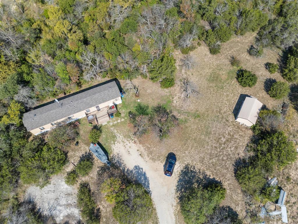 an aerial view of a house with a yard