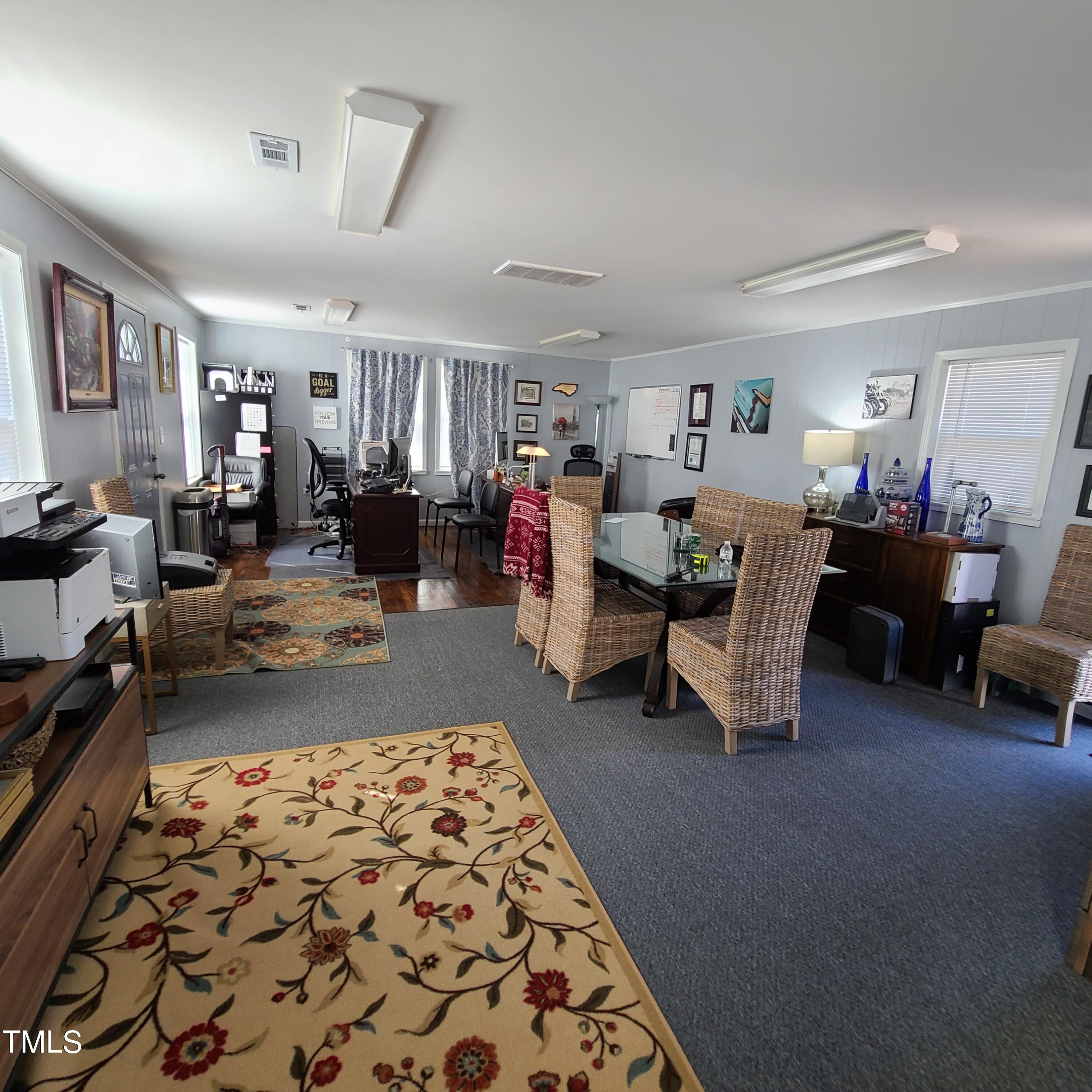 a living room with furniture and a rug