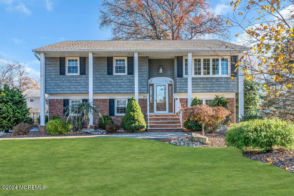 a front view of a house with a yard