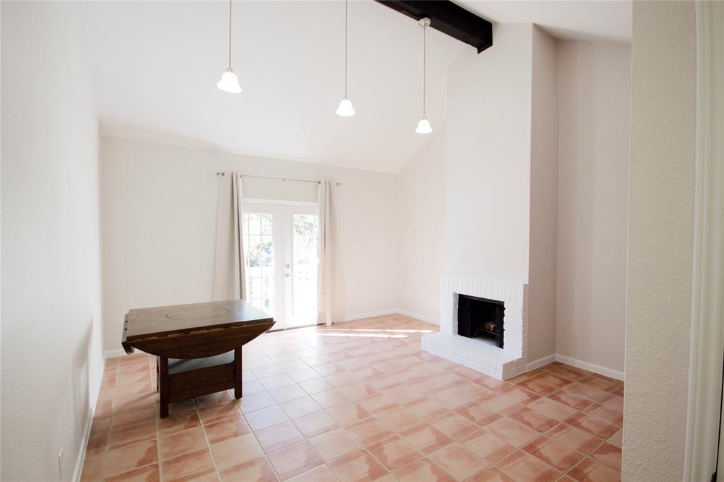 a living room with a couch and a floor to ceiling window