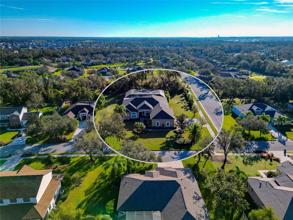 an aerial view of a house with a swimming pool