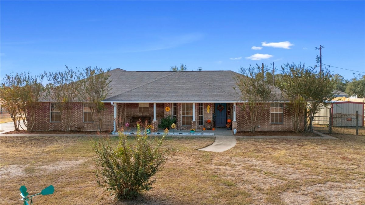 front view of a house with a yard