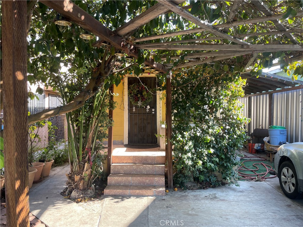 a view of a house with a tree